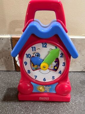 Fisher-Price Red and Blue Musical Learning Clock with Green Hand